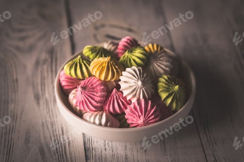 Preview: Bowl of colored meringues