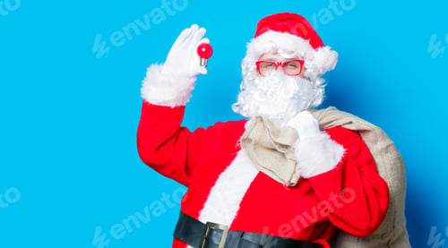Preview: Funny Santa Claus have a fun with light bulb