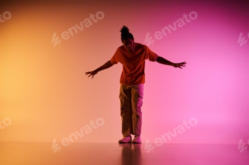 Preview: Young dancer posing against a vibrant gradient background