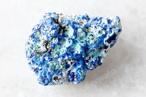 Preview: raw azurite and gibbsite mineral on white marble