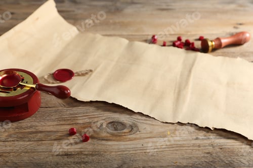 Preview: Old paper scroll with wax seal and stamp on wooden table, closeup