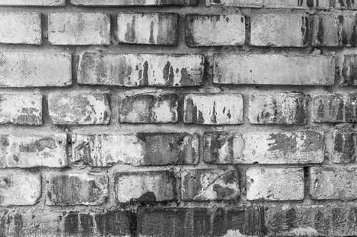 Preview: Weathered brick wall in black and white for vintage architecture and textured background concept