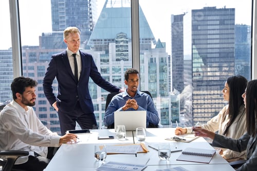 Preview: Busy diverse professional business team at group meeting in boardroom.
