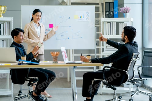 Preview: Asian manager point to project on board that present by pretty business woman in meeting room