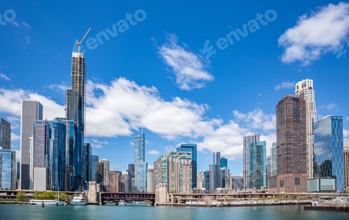 Preview: Chicago city skyscrapers on the river canal, blue sky background