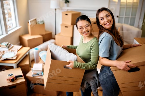 Preview: Happy female friends moving into new apartment.
