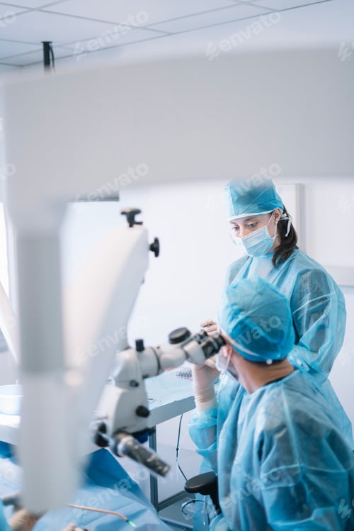 Preview: Dentist during a dental intervention with a patient. Dental clinic concept.