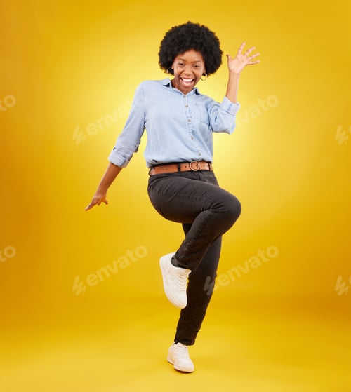 Preview: Happy, excited and portrait of black woman on yellow background with energy, happiness and smile in