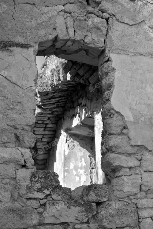 Preview: Arch window opening in ancient collapsed building. Ruins, old stone building.