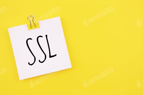 Preview: Note written on a white sticker with paper clip on a yellow background . Inscription SSL