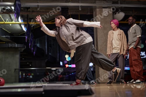 Preview: Friends Playing Bowling in Modern Indoor Alley