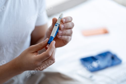 Preview: Person holding a lancing device for accurate blood glucose monitoring