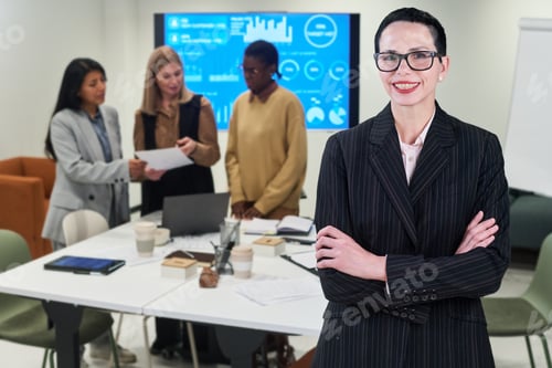 Preview: Portrait of Middle Aged Caucasian Woman Smiling in Modern Office Meeting