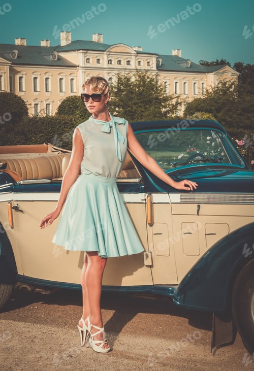 Preview: Beautiful lady near classic convertible