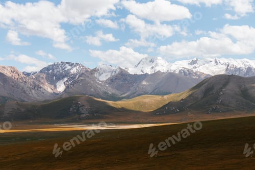 Preview: Vast mountain valley with snowcapped peaks