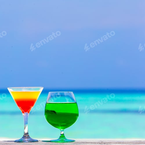 Preview: Colorful exotic tasty cocktails in outdoor cafe background turquoise ocean