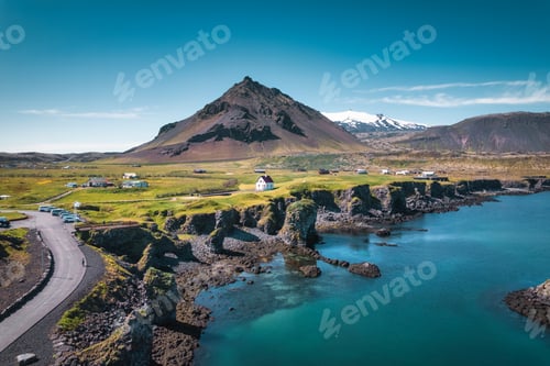 Preview: Arnarstapi fishing village with nordic house and stapafell mountain on coastline in Snaefellsnes