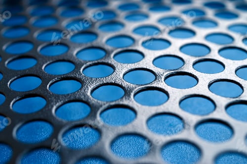 Preview: Black metal computer case panel mesh with holes on blue background. Abstract close up image