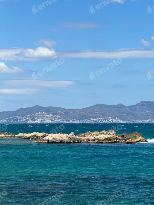 Preview: A rocky shoreline with a blue ocean in the background