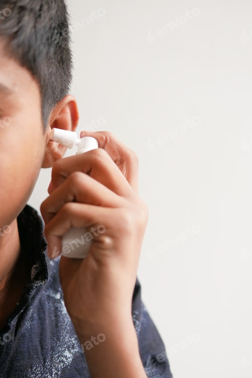 Preview: Close up of men using spray to remove earwax
