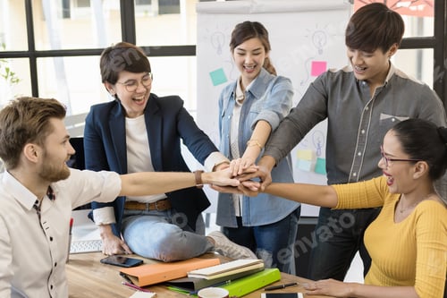 Preview: Diverse happy business team in casual style Hands Together