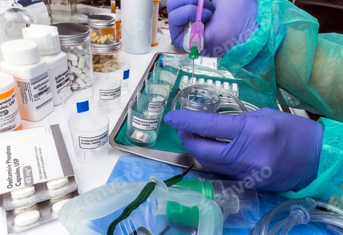 Preview: Nurse refilling medication solution nebulizer container