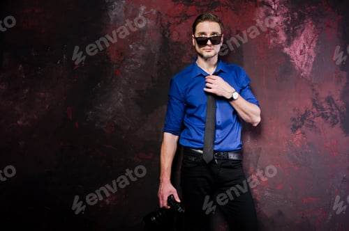 Preview: Studio portrait of stylish professional photographer