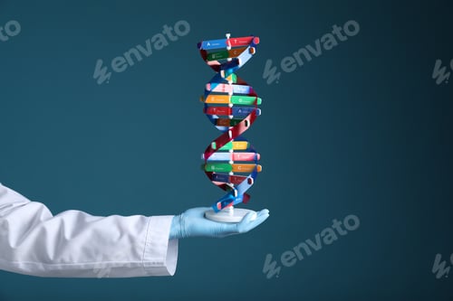 Preview: Scientist holding DNA structure model on dark blue background, closeup