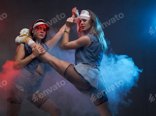 Preview: Graceful and charming group of two girls dancing in atmospheric studio