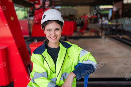 Preview: Female automation engineer standing in modern industrial.
