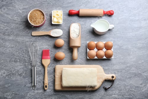 Preview: Flat lay composition with puff pastry dough and ingredients on grey table