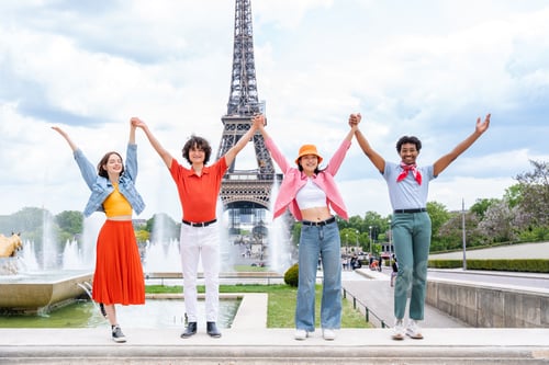 Preview: Group of young happy friends visiting Paris and Eiffel Tower