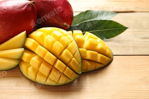 Preview: Composition with fresh mango on light wooden background, closeup