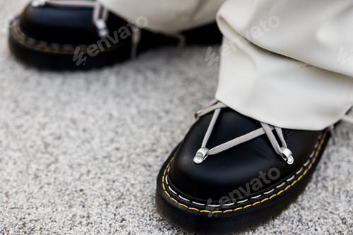 Preview: Closeup of cool trendy black boots with abstract lace design