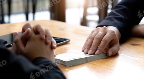 Preview: Two businesspeople having a business negotiation meeting in the office, A businessman giving a bribe