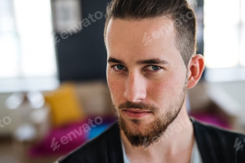 Preview: A portrait of young man indoors, a close-up