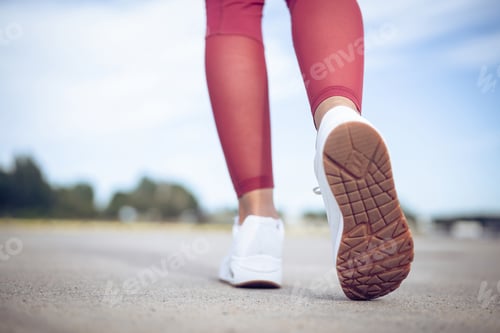 Preview: girl soprtsman runs in the morning in sneakers