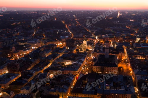 Preview: Twilight Aerial View of Lviv City with Illuminated Streets and Buildings, Ukraine