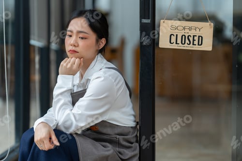 Preview: An Asian barista is stressed and bored because the economy has caused a sharp drop in coffee shop sa