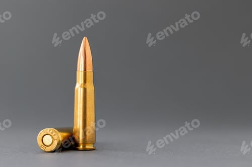 Preview: Two bullets on gray background. Cartridges 7.62 caliber for Kalashnikov assault rifle