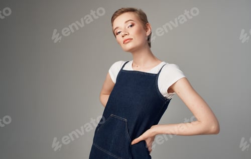 Preview: Woman with short hair Makeup on her face gray background