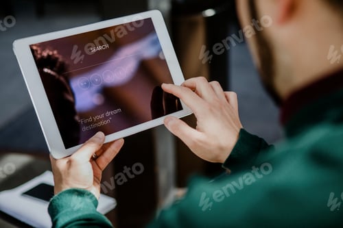 Preview: Man using digital tablet