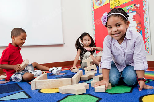 Preview: Children on floor with building blocks