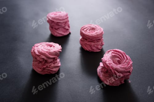 Preview: Homemade pink marshmallow on a black background. Top view