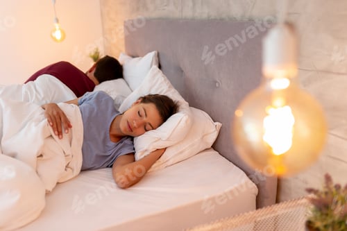 Preview: Couple sleeping in bed in the morning