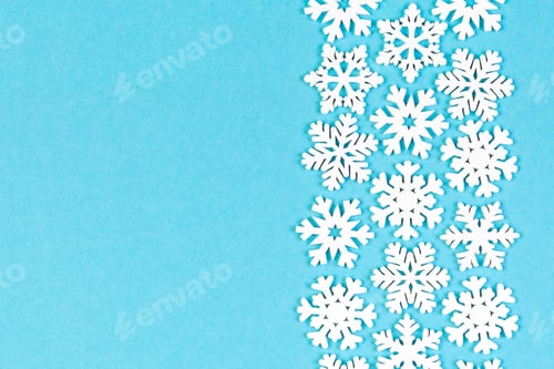 Preview: Set of white snowflakes on colorful background. Top view of Christmas ornament.