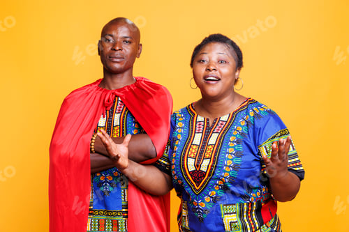 Preview: Man in superman cape with woman