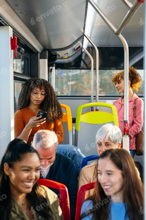 Preview: Commuters using mobile technology on public city bus