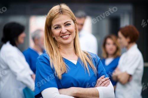 Preview: Front view of of woman doctor looking at camera, corona virus concept.