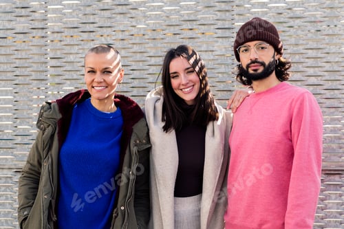 Preview: friends enjoying and smiling looking at camera